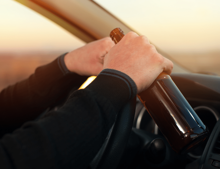 Person driving with a beer in their hand in south florida