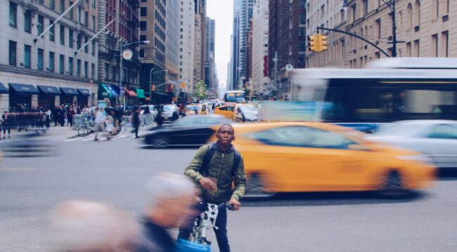 man on bike in traffic