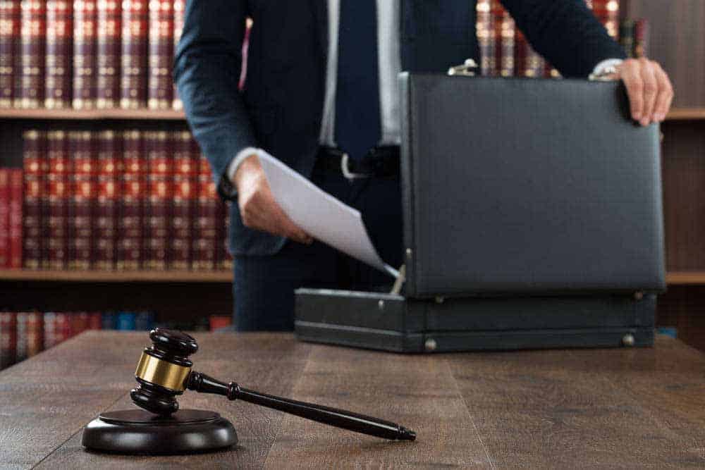 gavel and man with briefcase