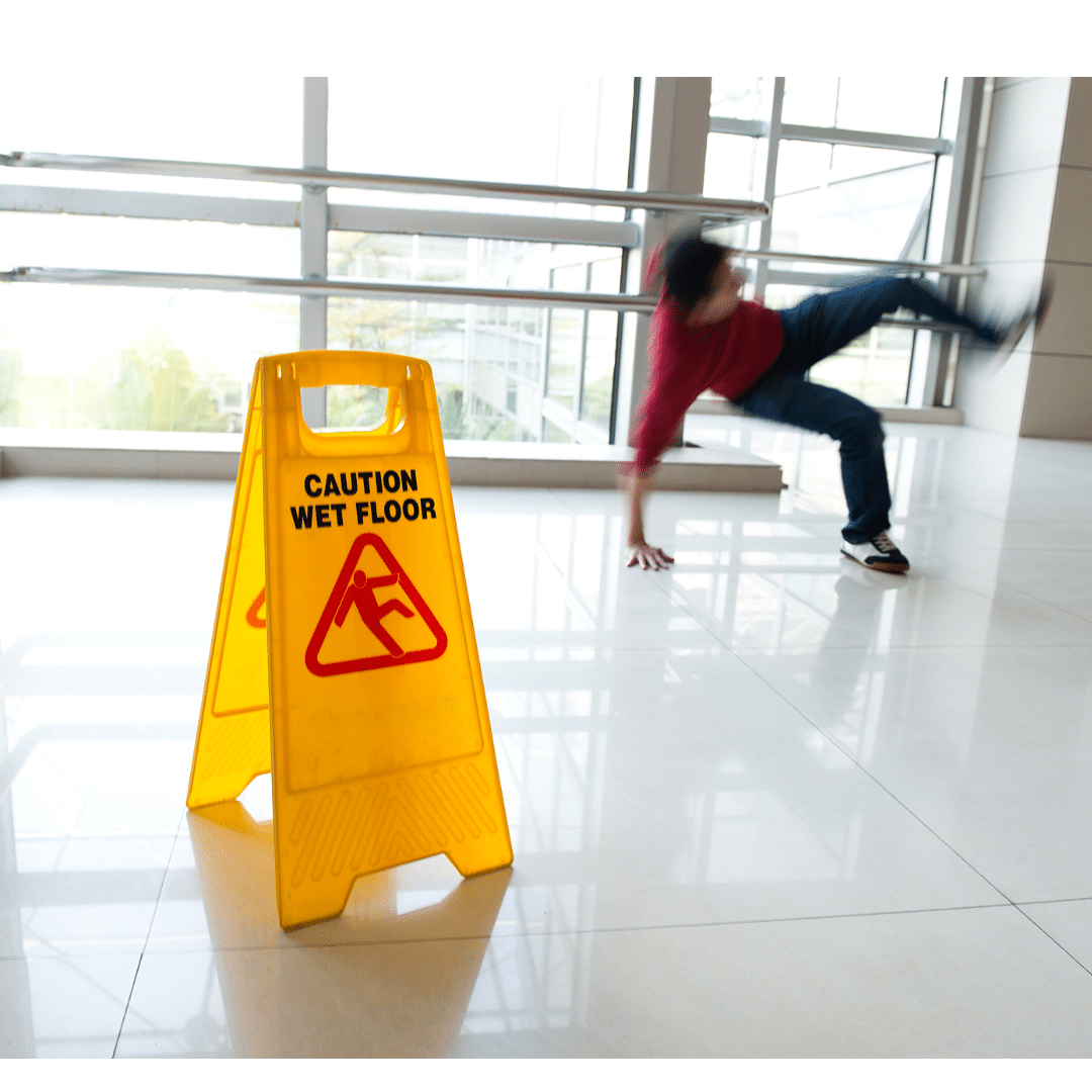 slip and fall sign with man falling in background