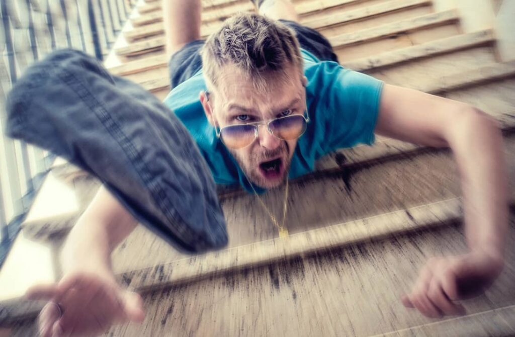 man falling down stairs